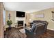 Cozy living room with a fireplace, large TV, and comfortable seating area at 7215 Braxton Dr, Noblesville, IN 46062