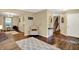 Open-concept living area with hardwood floors, and neutral paint at 7215 Braxton Dr, Noblesville, IN 46062
