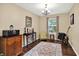 Cozy room with an area rug, a cabinet and some musical instruments at 7215 Braxton Dr, Noblesville, IN 46062