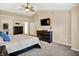 Well-lit main bedroom with a king-sized bed, large dresser, and walk-in closet at 7215 Braxton Dr, Noblesville, IN 46062