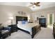 Spacious main bedroom with a king-sized bed, vaulted ceiling, and ensuite bathroom at 7215 Braxton Dr, Noblesville, IN 46062
