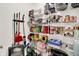 Well-stocked pantry with ample shelving for storage solutions, cleaning supplies, and other household essentials at 7215 Braxton Dr, Noblesville, IN 46062