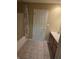Bathroom featuring tile floor and a shower-tub combo with a floral shower curtain at 7440 Oakview Dr, Avon, IN 46123