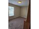 Bedroom with neutral walls, carpet, and a window for natural light at 7440 Oakview Dr, Avon, IN 46123