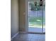 Dining area with tiled floor offers direct access to a spacious backyard through sliding glass door at 7440 Oakview Dr, Avon, IN 46123