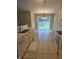 Bright kitchen with yellow cabinets, tile floor and sliding doors to the backyard at 7440 Oakview Dr, Avon, IN 46123