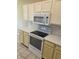 Well-equipped kitchen with white cabinets, stainless steel appliances, and subway tile backsplash at 7440 Oakview Dr, Avon, IN 46123