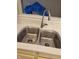 Stainless steel kitchen sink with modern fixtures and white tile backsplash at 7440 Oakview Dr, Avon, IN 46123