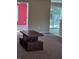 Open living area with sliding door to backyard, carpet, and furniture at 7440 Oakview Dr, Avon, IN 46123
