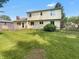 Expansive backyard with a spacious lawn, mature trees, and a deck, offering an ideal space for outdoor enjoyment at 757 Winter Way, Carmel, IN 46032