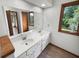 Bright bathroom with dual sinks, a large mirror, and natural light, creating a functional and refreshing space at 757 Winter Way, Carmel, IN 46032