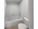 Bright bathroom offers a standard bathtub, a shower with white tile, and a toilet at 757 Winter Way, Carmel, IN 46032