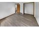 Bright bedroom boasts an open closet, neutral walls, and durable, stylish flooring at 757 Winter Way, Carmel, IN 46032