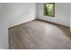 Cozy bedroom with hardwood floor and a window with tree view at 757 Winter Way, Carmel, IN 46032