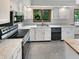 Modern kitchen features stainless steel appliances, granite countertops, and white cabinetry at 757 Winter Way, Carmel, IN 46032