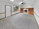 Gathering room with skylight, wood-burning fireplace and built-in cabinets and shelving at 757 Winter Way, Carmel, IN 46032