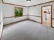 Bright living room with large window and view to the kitchen area at 757 Winter Way, Carmel, IN 46032