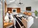 Bright living room featuring vaulted ceiling, built-in shelving, and fireplace, creating a cozy and inviting space at 757 Winter Way, Carmel, IN 46032