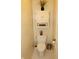 Neutral powder room offers vanity with modern fixtures, and toilet at 7662 Micawber Ct, Indianapolis, IN 46256