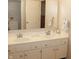 Updated bathroom features double vanity with modern fixtures, and ample counter space at 7662 Micawber Ct, Indianapolis, IN 46256