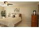 Serene bedroom with soft neutral tones, a comfortable bed, and a ceiling fan for a relaxing retreat at 7662 Micawber Ct, Indianapolis, IN 46256