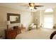 Serene bedroom with a comfortable seating area, a large window seat and natural lighting at 7662 Micawber Ct, Indianapolis, IN 46256
