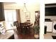 Charming dining room featuring hardwood floors, elegant lighting, and patio access at 7662 Micawber Ct, Indianapolis, IN 46256