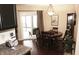 Relaxing dining area with hardwood floors, natural light, and backyard view at 7662 Micawber Ct, Indianapolis, IN 46256
