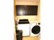 Functional laundry area with modern washer and dryer, maximizing space at 7662 Micawber Ct, Indianapolis, IN 46256