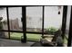 Sunroom with chairs provides a great view of the yard and garden at 7662 Micawber Ct, Indianapolis, IN 46256