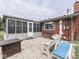 Inviting back patio with ample seating, a fire pit, and stone pavers for outdoor comfort at 784 S Restin Rd, Greenwood, IN 46142
