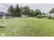 Large backyard with green lawn, shed, and mature trees creating a private outdoor space at 784 S Restin Rd, Greenwood, IN 46142