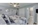 Neutral-toned bedroom featuring two closets, a view into the bathroom, and light-colored wood-look floors at 784 S Restin Rd, Greenwood, IN 46142
