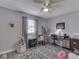 Bright bedroom features neutral paint, ceiling fan, modern carpet, desk, and a bookshelf at 784 S Restin Rd, Greenwood, IN 46142