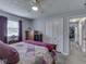 Bedroom features neutral paint, modern carpet, bed, dresser, and a closet at 784 S Restin Rd, Greenwood, IN 46142