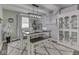 Dining room with table, chairs, bench, decorative cabinet and updated lighting at 784 S Restin Rd, Greenwood, IN 46142