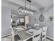 Dining room showcases a table with seating for six, designer light fixture, and access to the living room at 784 S Restin Rd, Greenwood, IN 46142