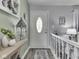 Inviting foyer featuring a white door, modern decor, and elegant flooring at 784 S Restin Rd, Greenwood, IN 46142