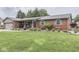 Beautiful brick home with a well-manicured lawn and inviting front porch, enhancing curb appeal at 784 S Restin Rd, Greenwood, IN 46142