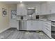 Kitchen featuring white cabinets, updated countertops, and stainless steel dishwasher at 784 S Restin Rd, Greenwood, IN 46142