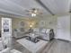 Spacious living room features a comfortable sofa, coffee table, and a view into the kitchen at 784 S Restin Rd, Greenwood, IN 46142