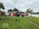 Large backyard with a screened-in porch, lush grass and potential for outdoor enjoyment at 7918 Bonita Ct, Indianapolis, IN 46219