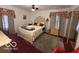 Bright bedroom with large windows, ceiling fan, and elegant curtains at 7918 Bonita Ct, Indianapolis, IN 46219