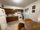 Efficient kitchen featuring wooden cabinets and white appliances at 7918 Bonita Ct, Indianapolis, IN 46219