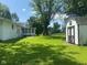 Spacious backyard with shed and large trees, perfect for outdoor activities and relaxation at 8008 Cherington Dr, Indianapolis, IN 46227