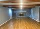 Open living room with fireplace and wood-look flooring at 8008 Cherington Dr, Indianapolis, IN 46227