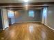 Spacious living room with open layout, adjacent to the bar and kitchen at 8008 Cherington Dr, Indianapolis, IN 46227