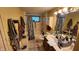 This bathroom features a tub, shower, double sink vanity and ample storage space at 8201 S Burlington Dr, Muncie, IN 47302