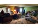 View of living room with carpeted floor and a lot of furniture at 8201 S Burlington Dr, Muncie, IN 47302