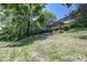 Landscaped backyard featuring mature trees and greenery, providing a serene and private outdoor setting at 8315 Union Chapel Rd, Indianapolis, IN 46240